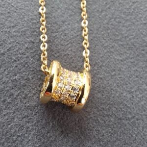 Cadena con tambor incrustado color oro